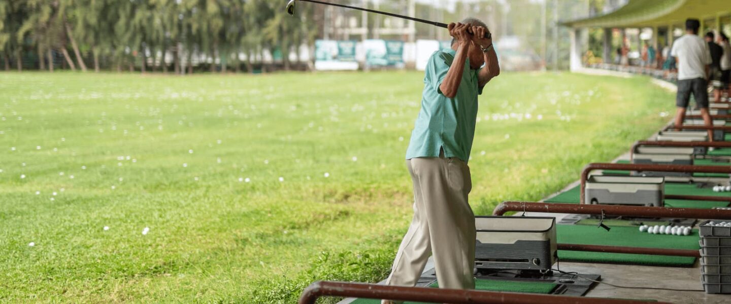 golfer practicing at a Tampa golf driving range